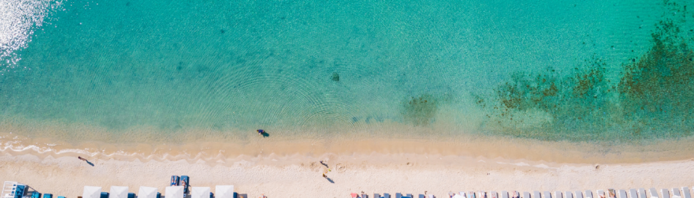 mykonos beach view with umbrellas